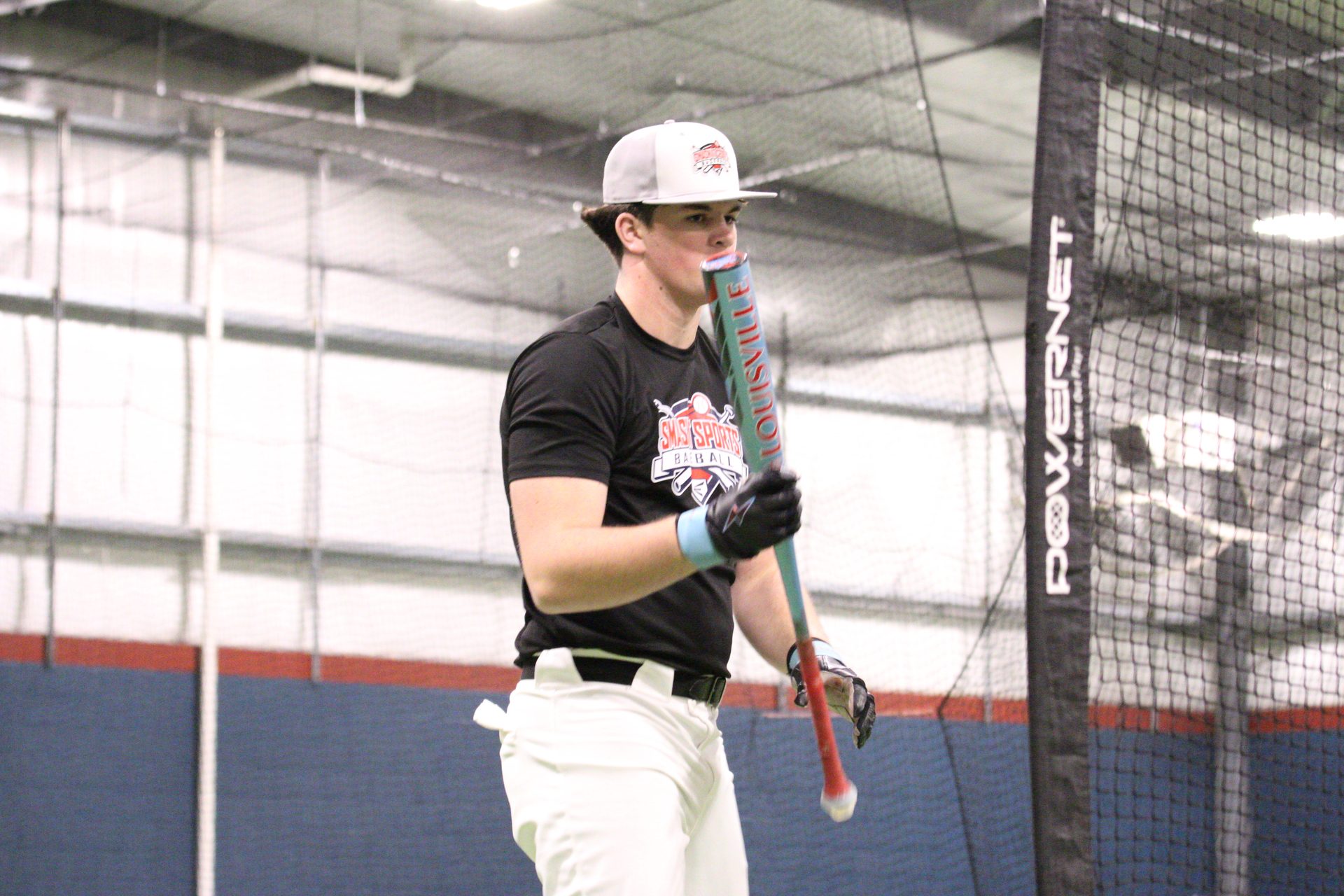 Athlete at batting cage